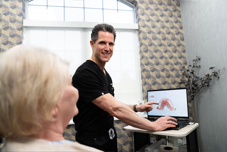 Doctor consulting with patient about the 3d scan of teeth