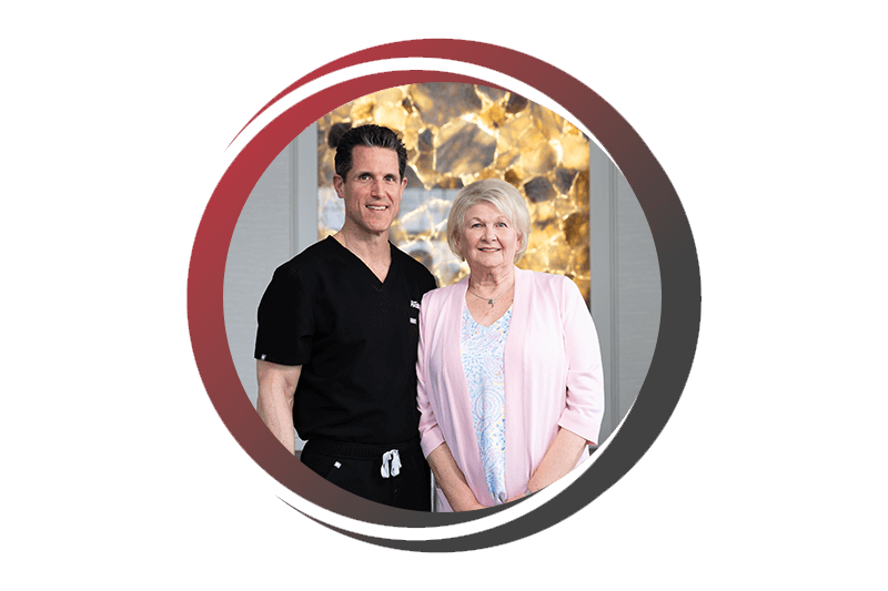 Doctor standing with patient smiling