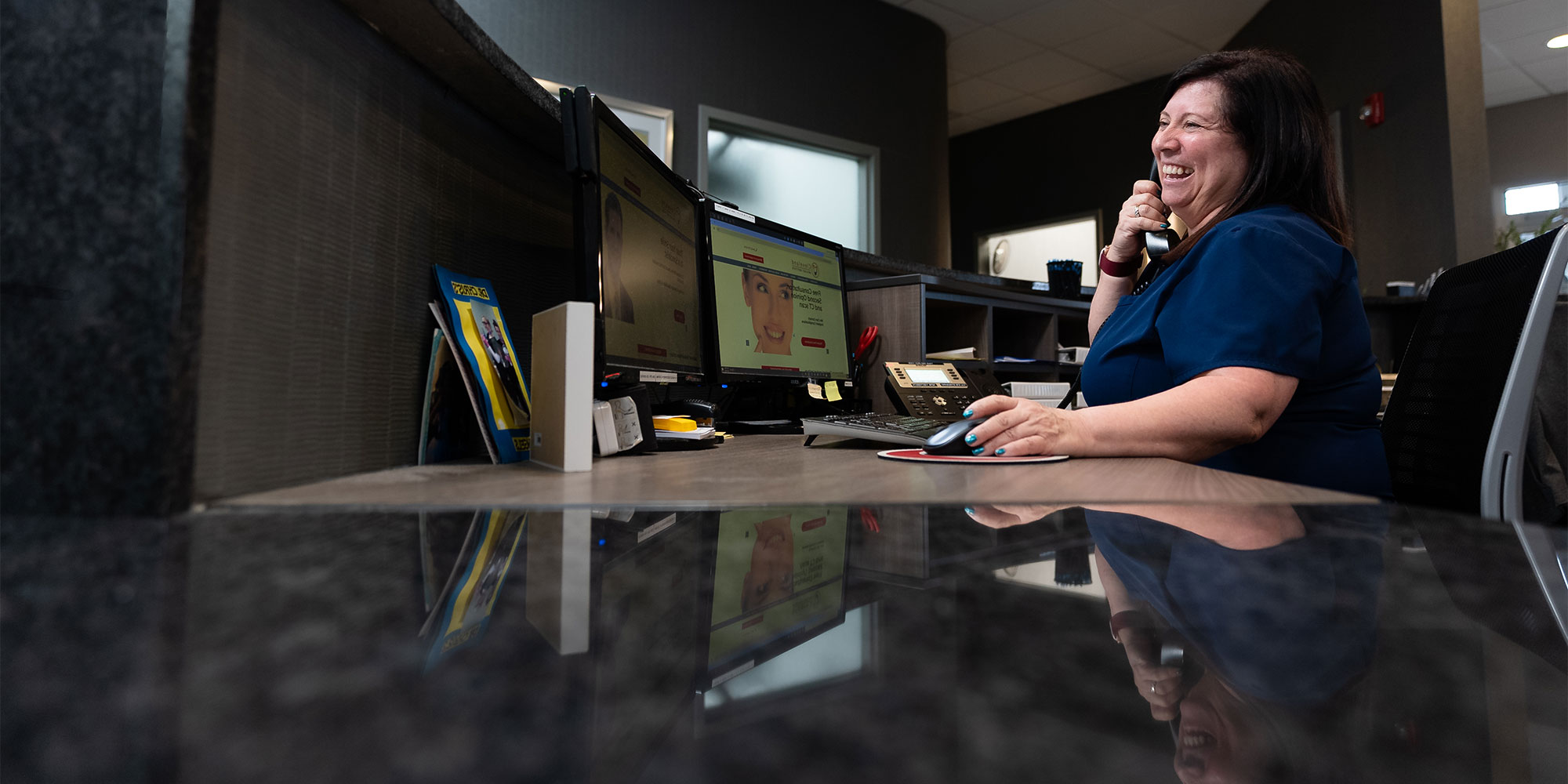 team member talking on the phone with a patient