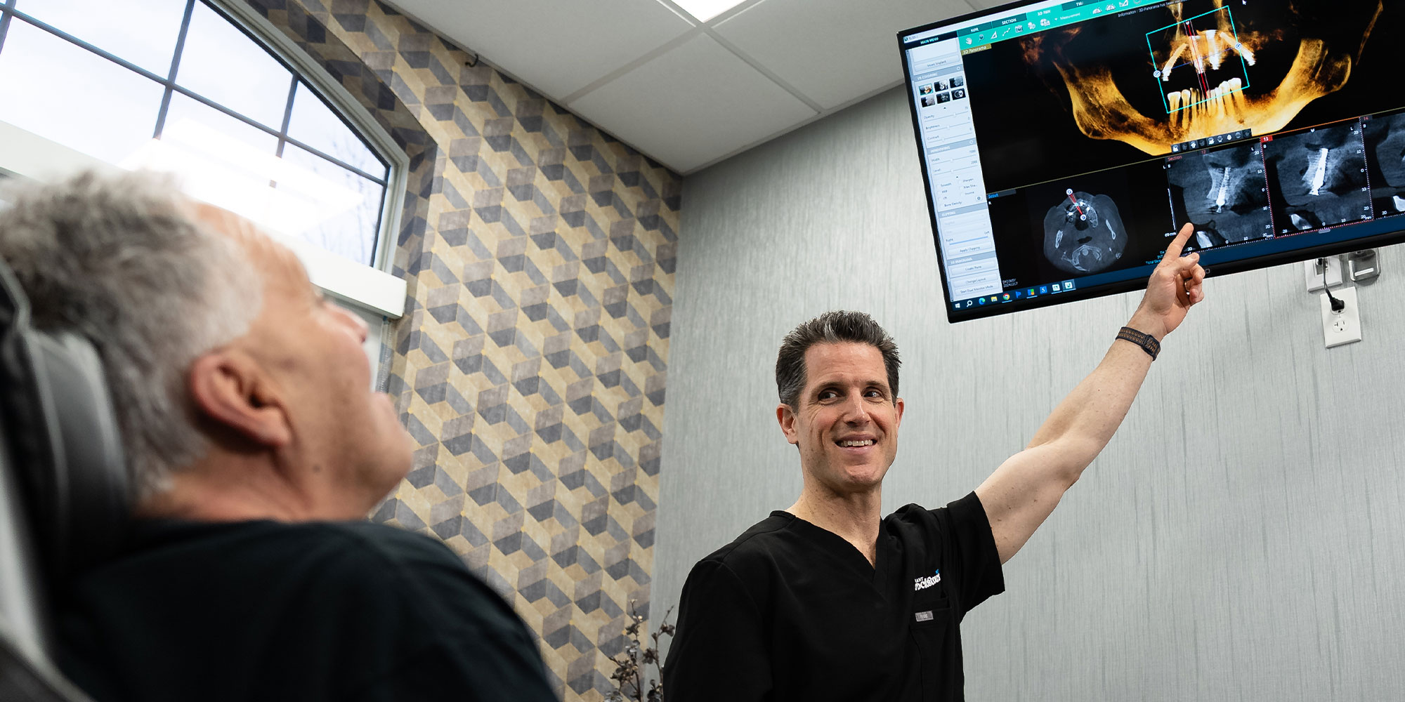 doctor going over patient x-ray with the patient