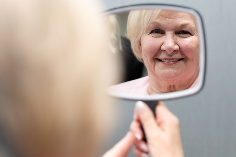 Patient Smiling looking at their new smile