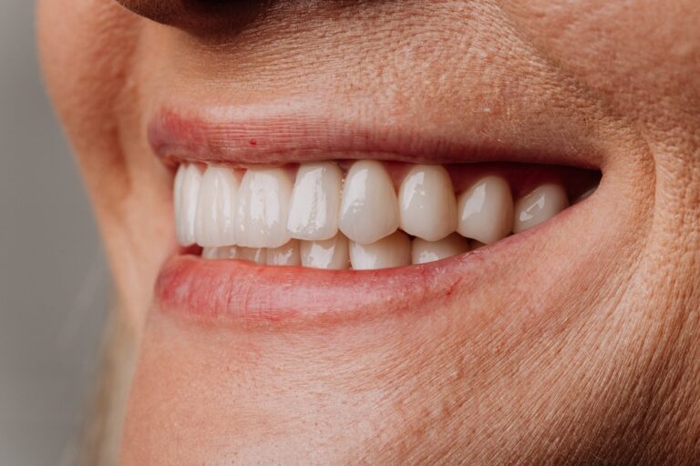 A friendly dentist in Concord, Ohio, is consulting with a smiling patient, reviewing digital dental scan results on a screen. The office environment is modern and welcoming. No text on image.