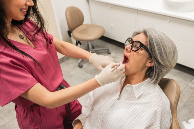 A modern dentist is consulting with a patient about dental implant options, pointing to a digital scan on a computer screen that shows the patient's jawbone and potential implant placement. The image has text that says "Implants: A Modern Solution".