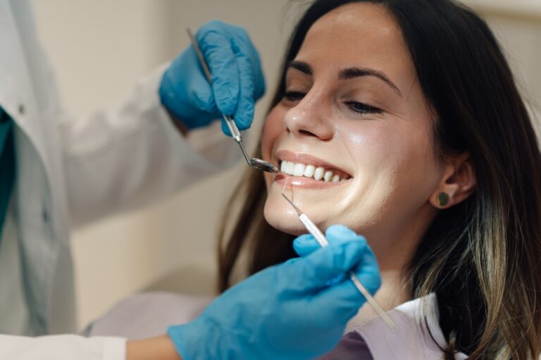 Dr. Michael Fioritto consulting with a patient about bad breath solutions in a modern dental office.