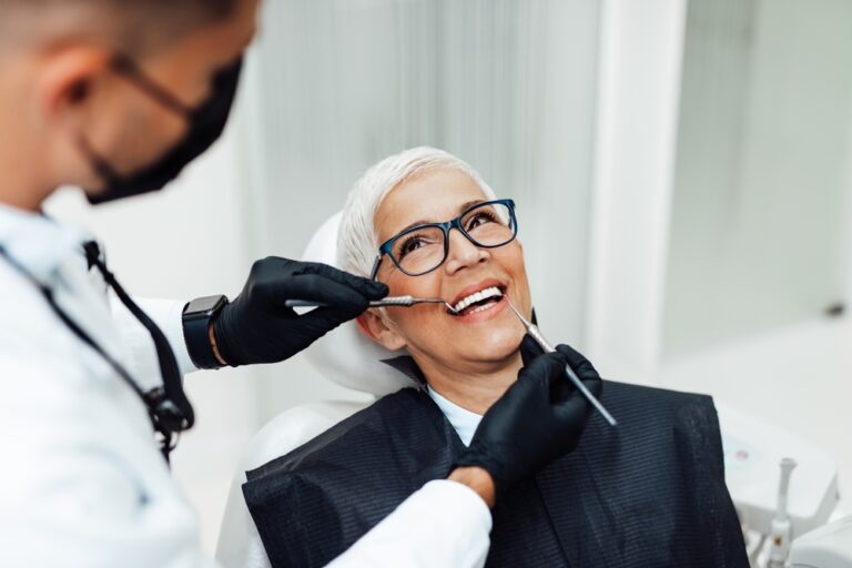 Dentist consulting with patient about crowns and veneers