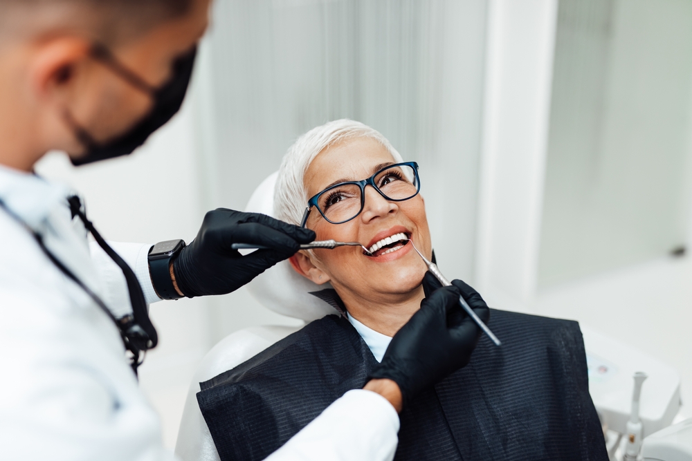 Dentist consulting with patient about crowns and veneers