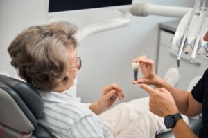 Dentist in Cleveland explaining dental implants to a patient.
