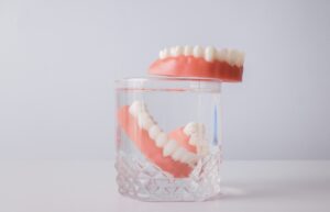 Dentist consulting a patient about missing molars in a modern dental office